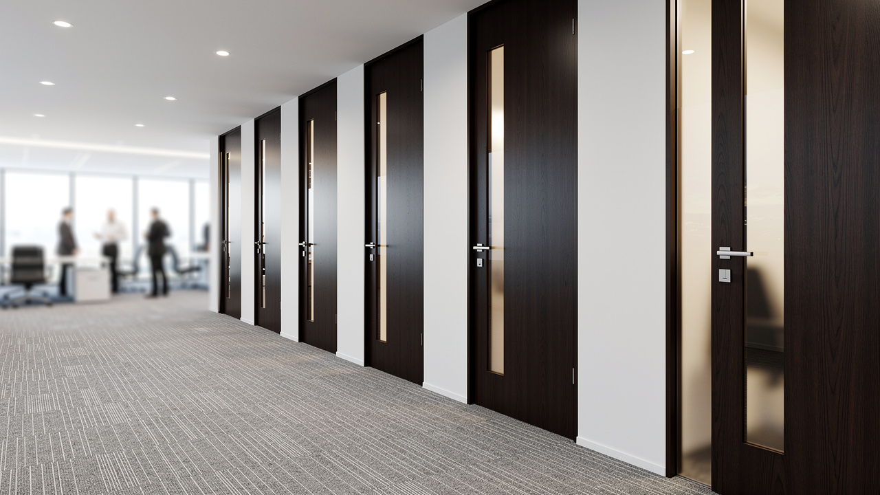 Solid-core acoustic doors separating meeting rooms in UAE office