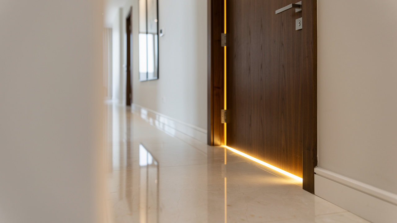 Light leaking under a door gap in UAE apartment