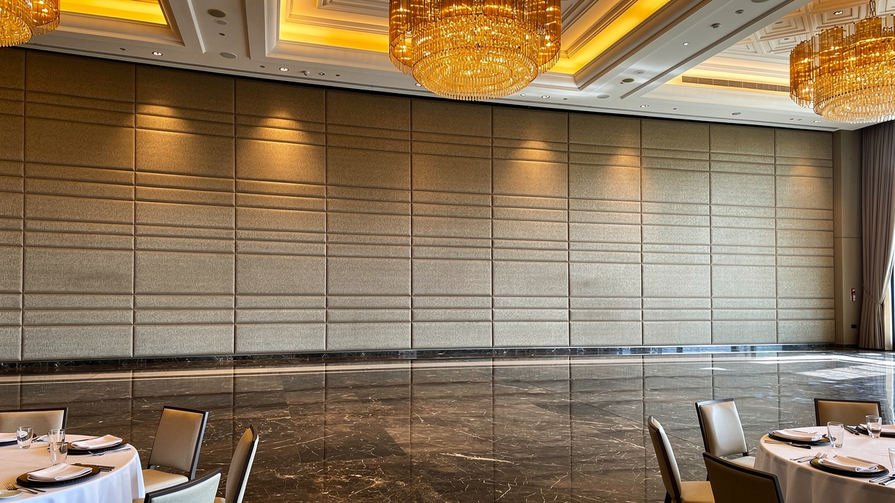 V-grooved acoustic fabric wall panels in luxury hotel ballroom